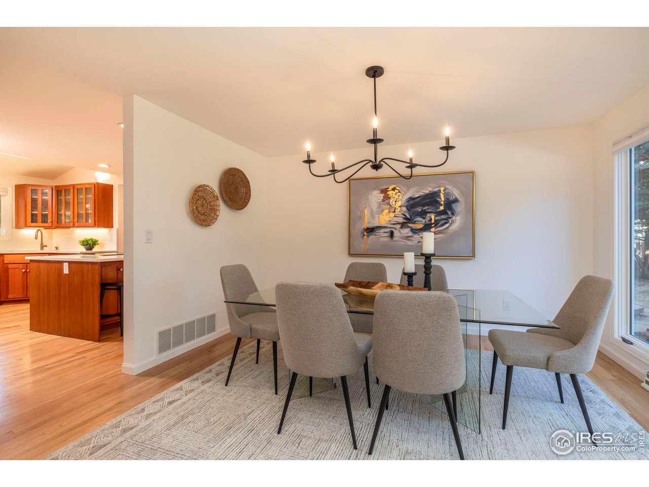 5332 Spotted Horse Trail Boulder, CO 80301 - Photo 6 of 40 a dining room with furniture and wooden floor
