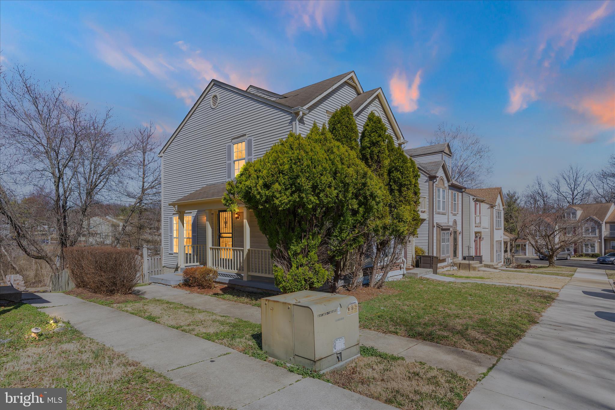 8710 Post Oak Way Landover, MD 20785 - Photo 1 of 38 a front view of a house with a garden