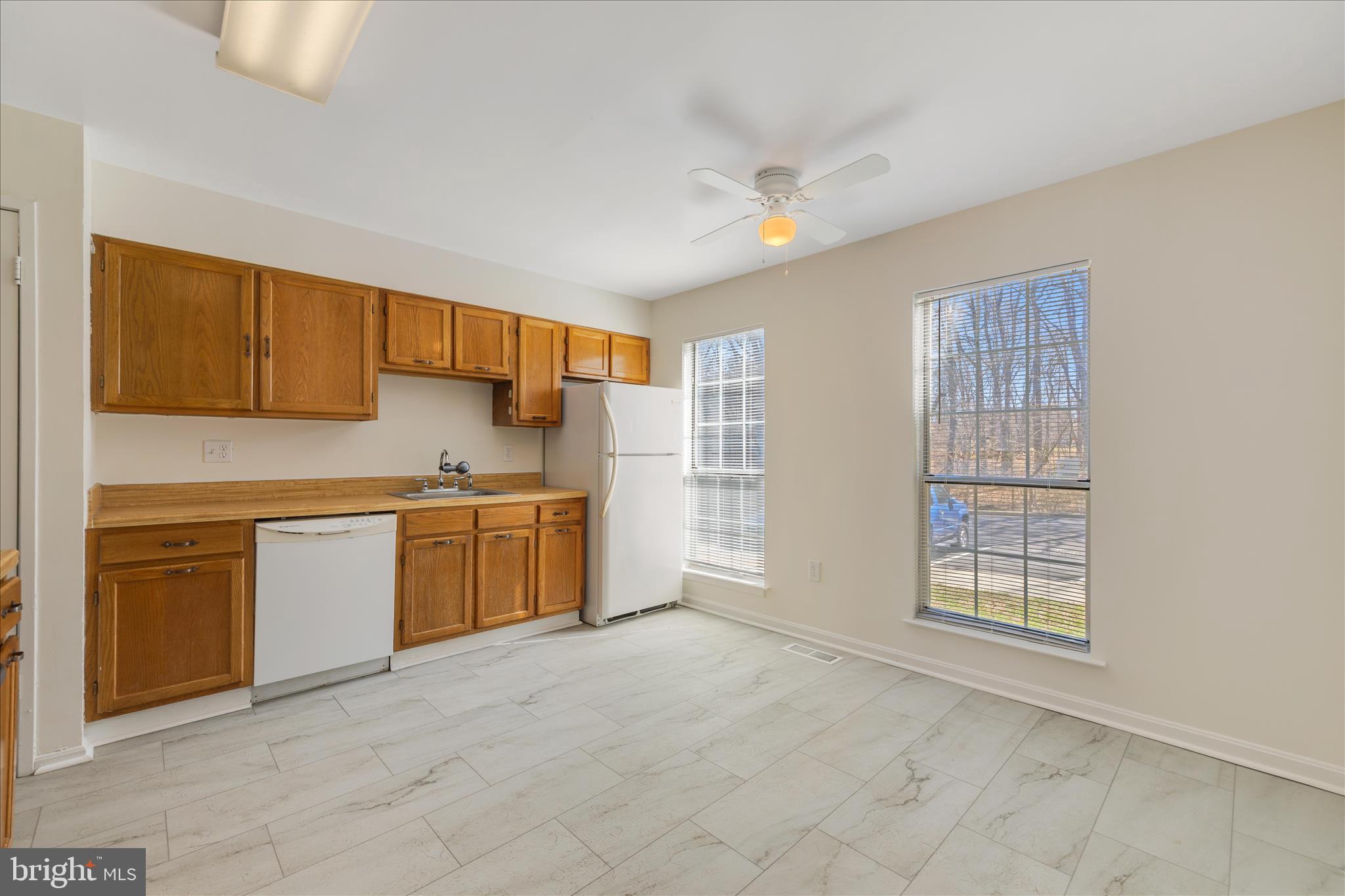 8710 Post Oak Way Landover, MD 20785 - Photo 11 of 38 a kitchen with stainless steel appliances granite countertop a stove sink and cabinets
