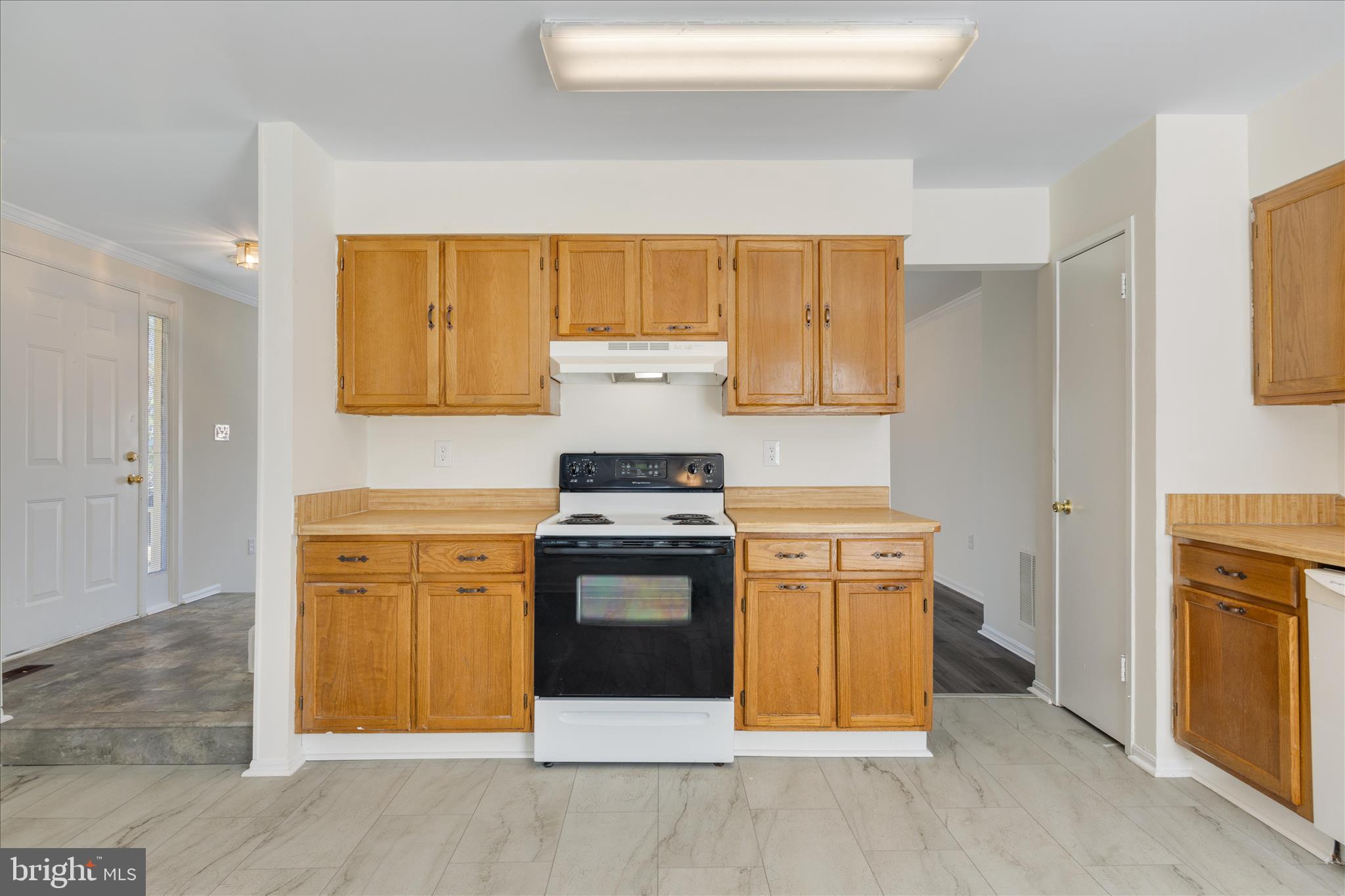 8710 Post Oak Way Landover, MD 20785 - Photo 12 of 38 a kitchen with stainless steel appliances granite countertop a stove and a refrigerator