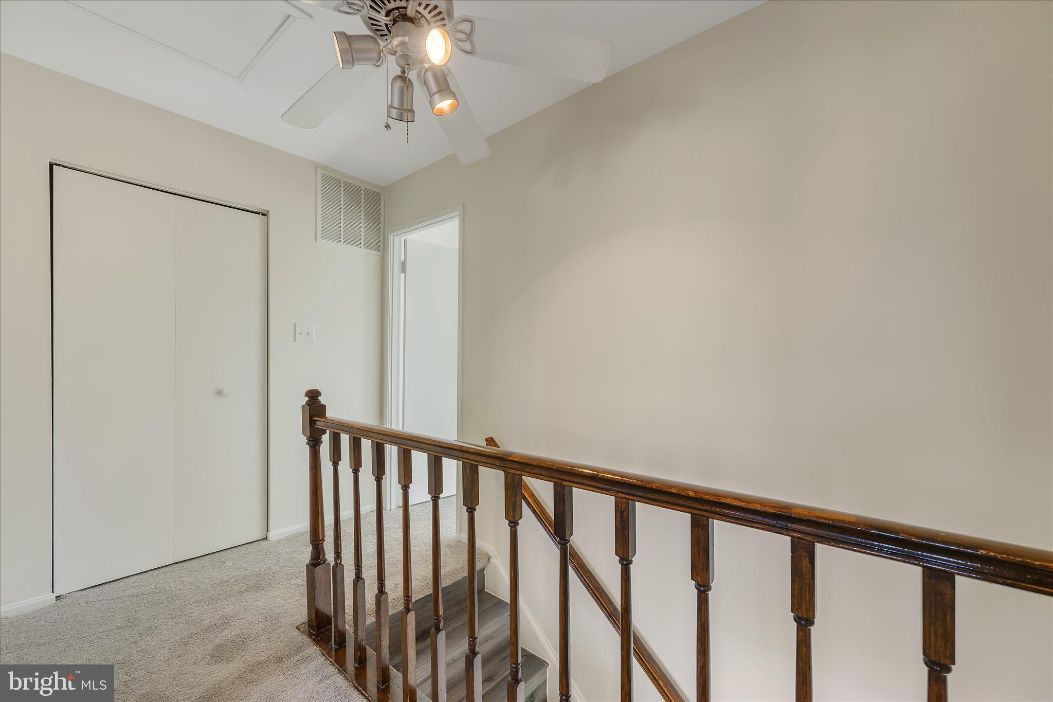 8710 Post Oak Way Landover, MD 20785 - Photo 15 of 38 a view of staircase with railing and chandelier fan