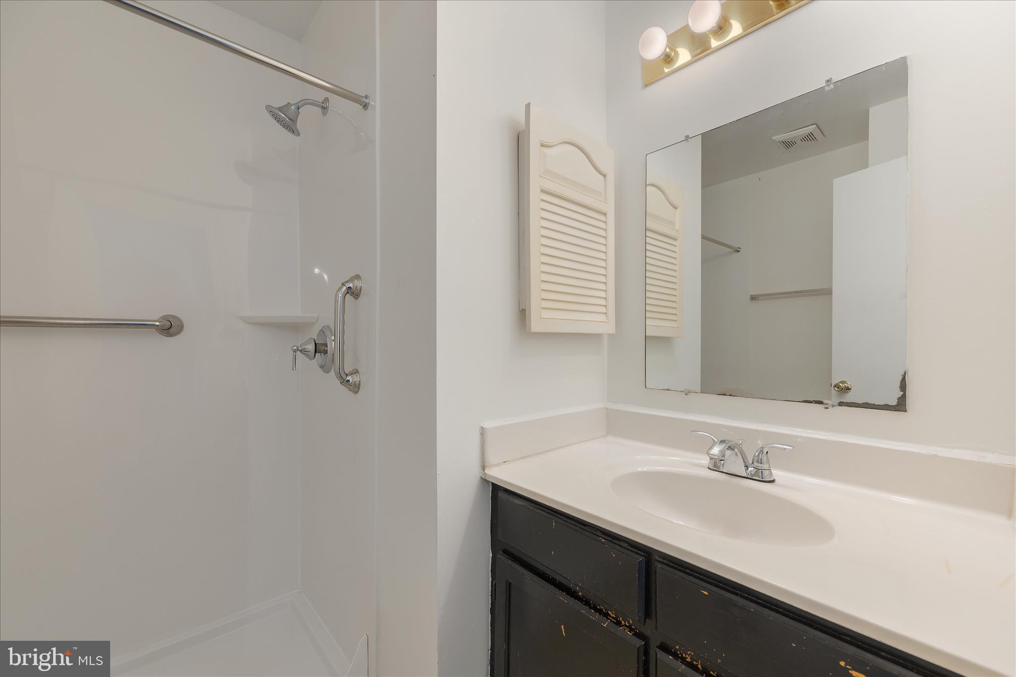 8710 Post Oak Way Landover, MD 20785 - Photo 18 of 38 a bathroom with a sink and a mirror