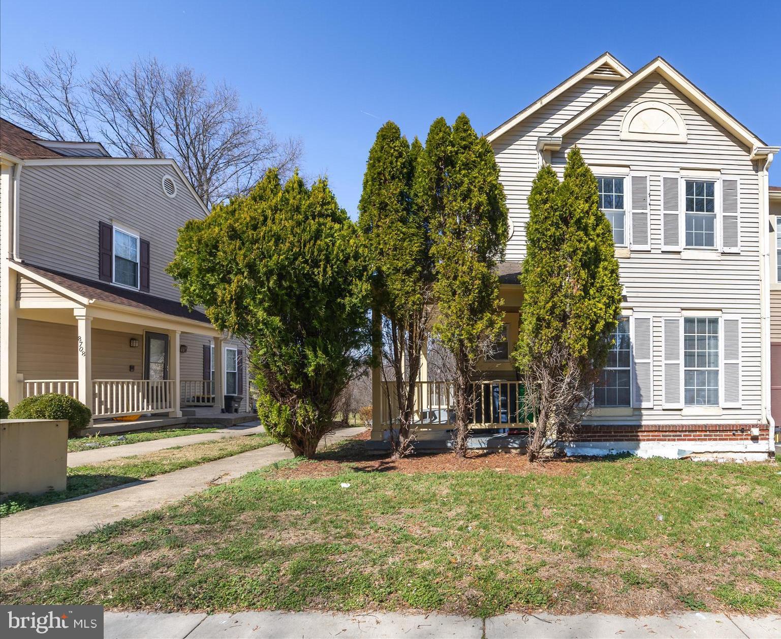 8710 Post Oak Way Landover, MD 20785 - Photo 2 of 38 a front view of a house with a yard