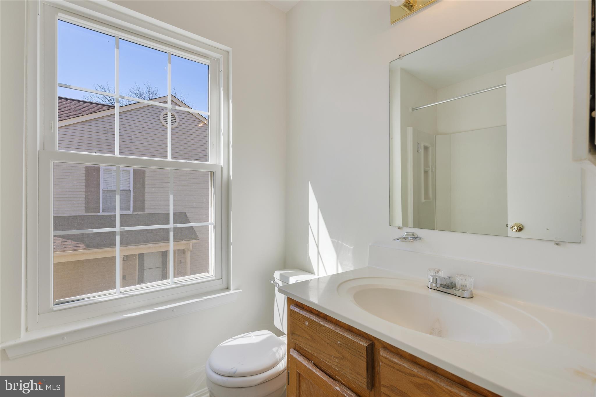 8710 Post Oak Way Landover, MD 20785 - Photo 24 of 38 a bathroom with a sink and a toilet