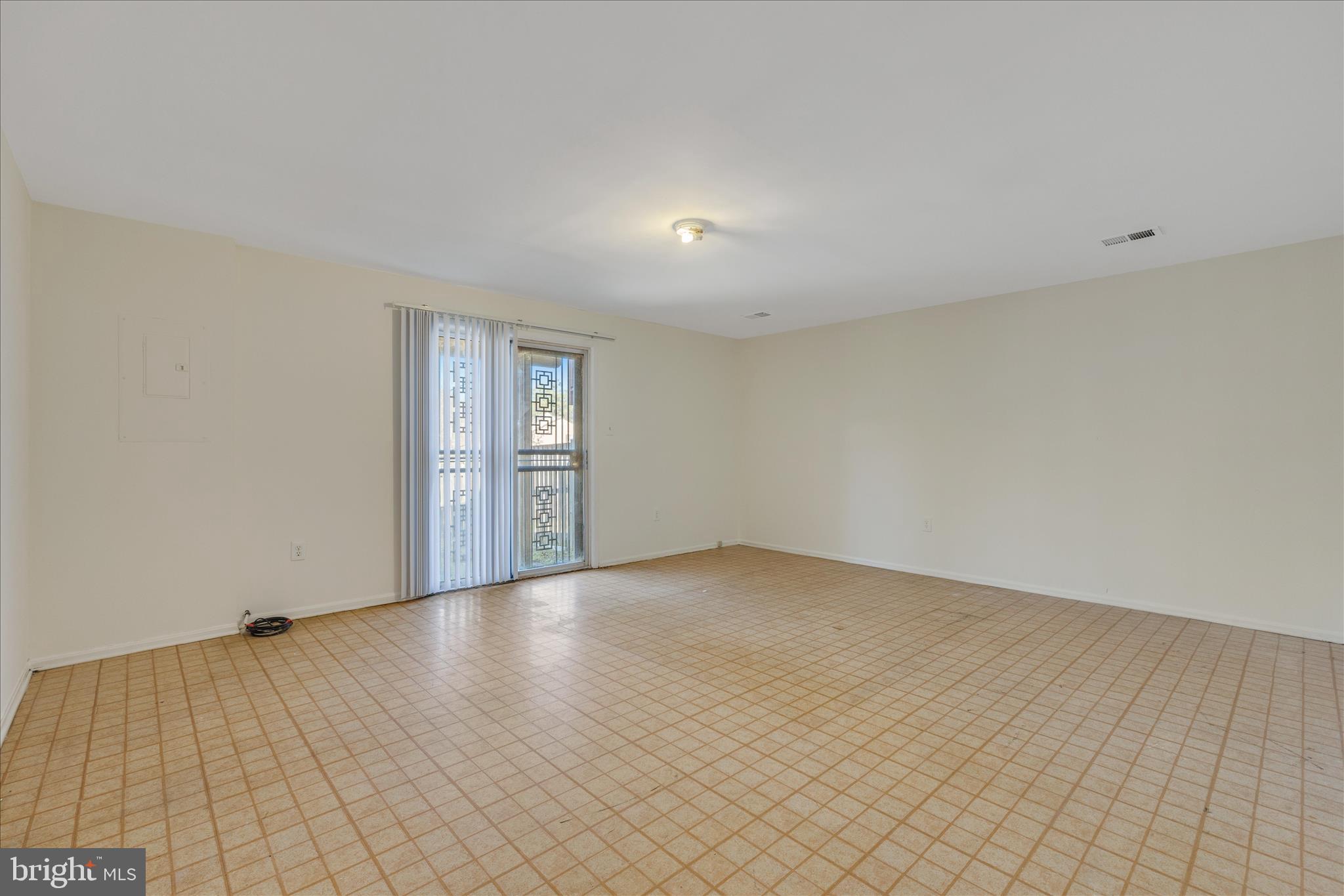 8710 Post Oak Way Landover, MD 20785 - Photo 27 of 38 a view of an empty room with window and wooden floor