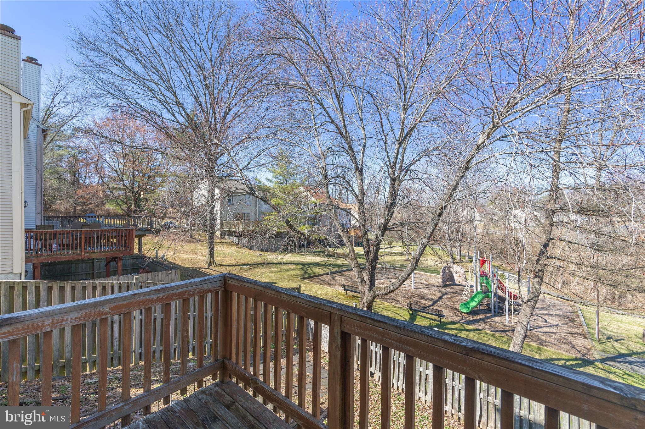 8710 Post Oak Way Landover, MD 20785 - Photo 29 of 38 a view of roof deck with wooden floor and fence
