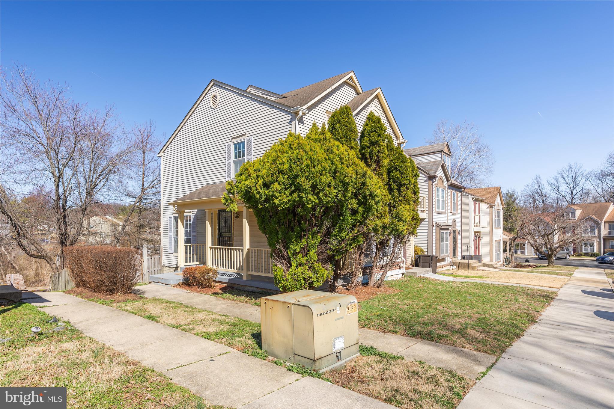 8710 Post Oak Way Landover, MD 20785 - Photo 3 of 38 a front view of a house with a yard