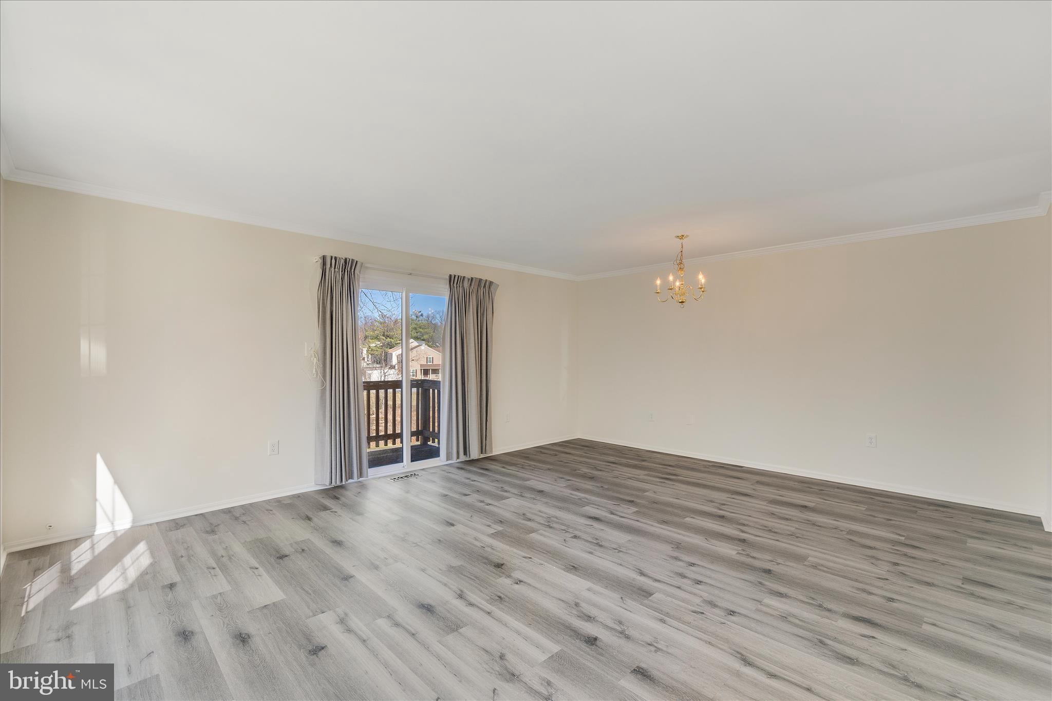 8710 Post Oak Way Landover, MD 20785 - Photo 6 of 38 a view of empty room with wooden floor