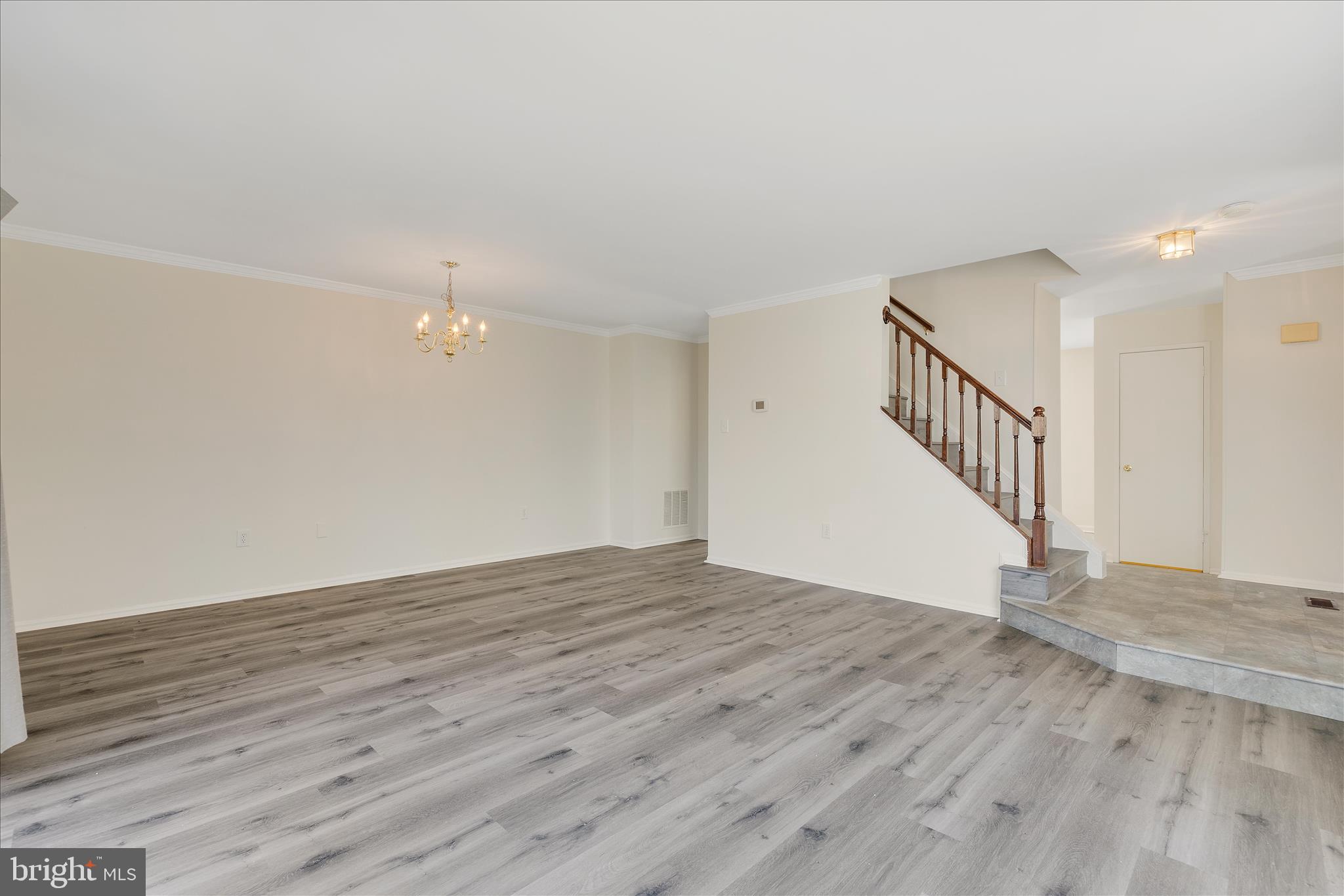 8710 Post Oak Way Landover, MD 20785 - Photo 7 of 38 a view of an empty room with wooden floor