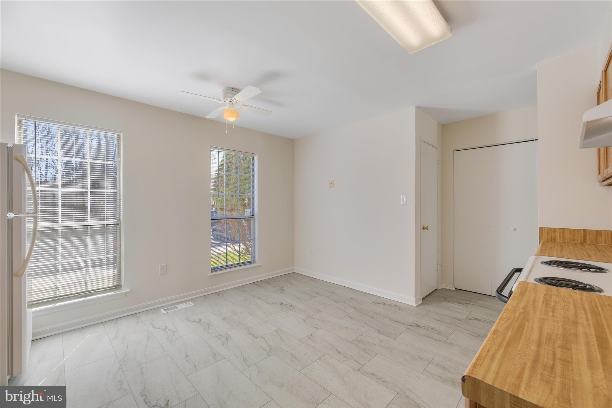 8710 Post Oak Way Landover, MD 20785 - Photo 9 of 38 an empty room with windows and closet