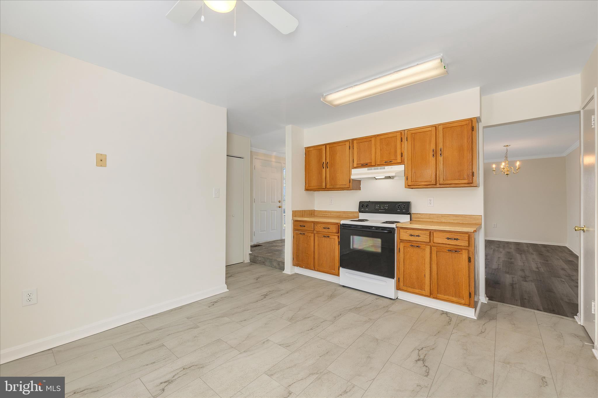 8710 Post Oak Way Landover, MD 20785 - Photo 10 of 38 a kitchen with granite countertop a stove top oven and sink
