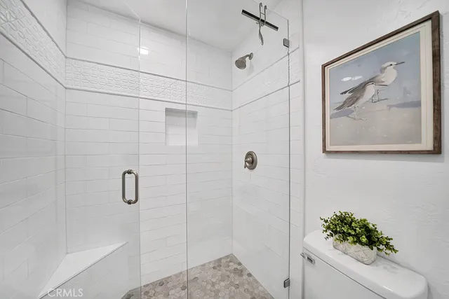 a bathroom with a shower and a shower
