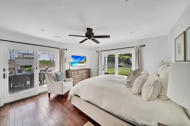 a bedroom with a large bed and a large window