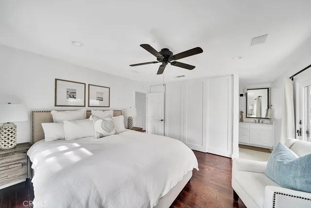 a bedroom with a large bed and a couch