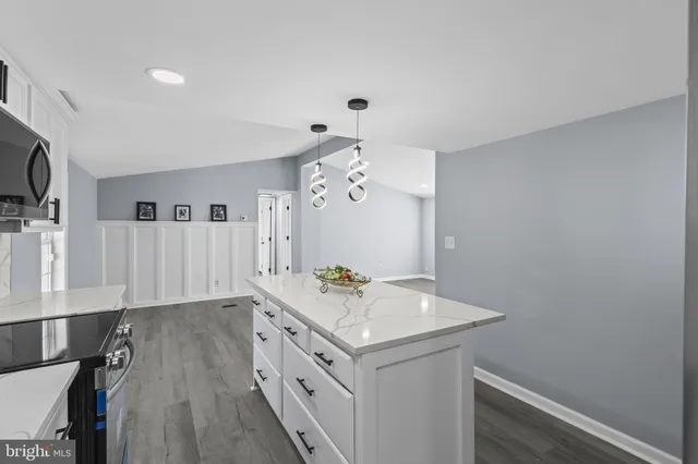 a bathroom with a sink a mirror and a shower