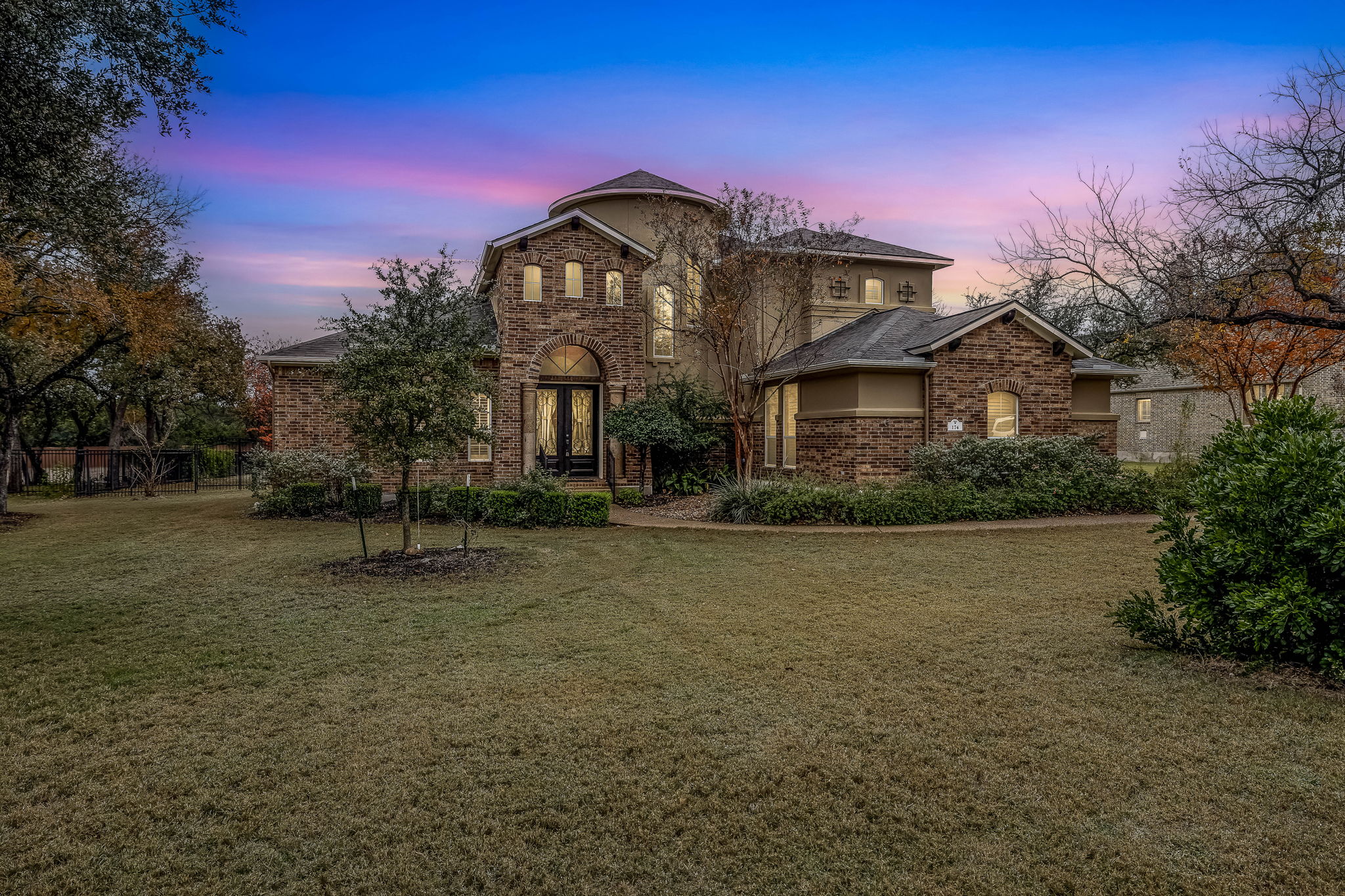 174 Estrella Crossing Georgetown, TX 78628 - Photo 37 of 38 View of front facade featuring a lawn and brick siding