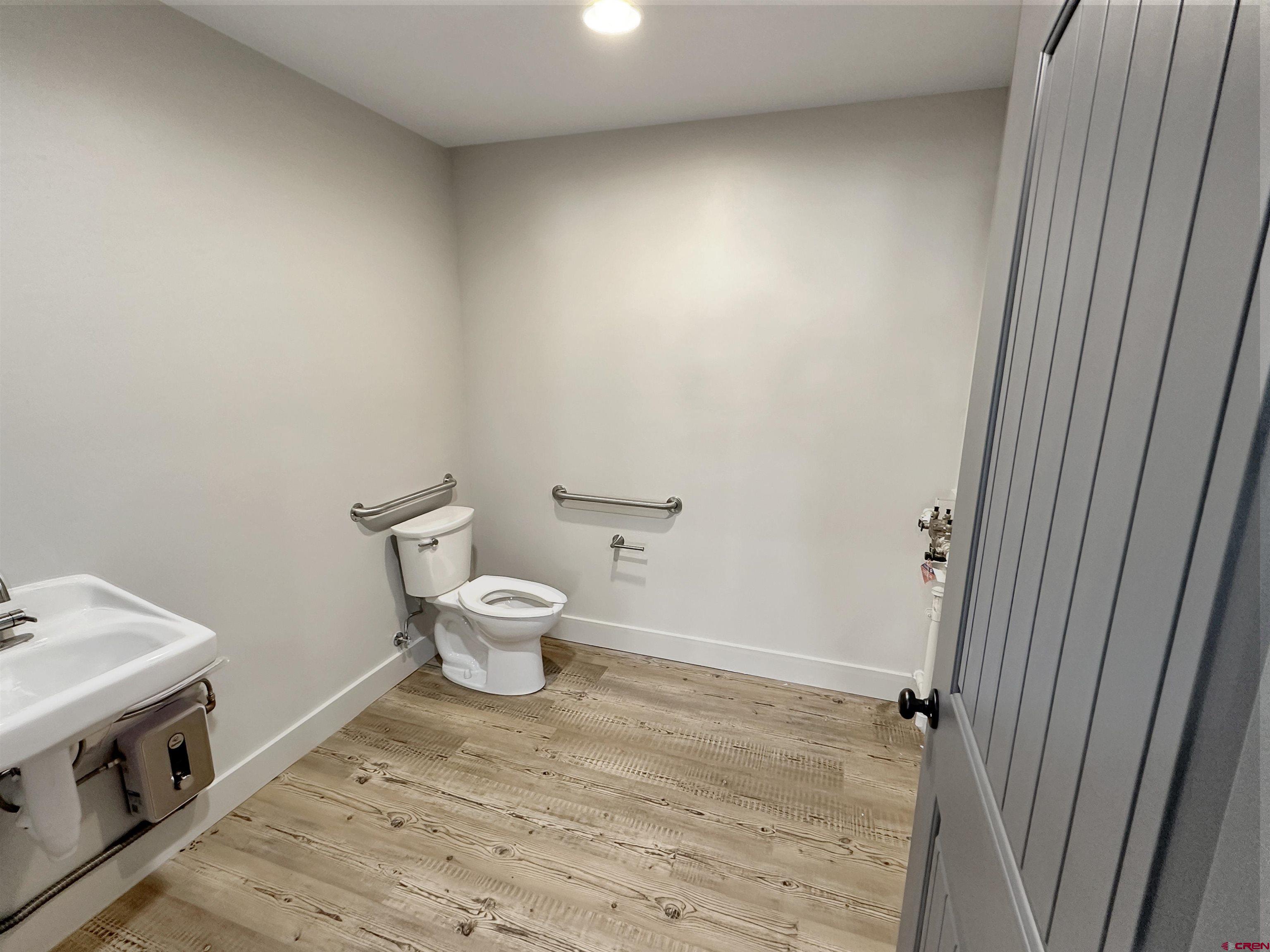 1110 Railroad Avenue, Unit C Dolores, CO 81323 - Photo 5 of 6 a bathroom with a sink and a toilet
