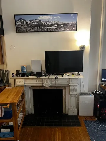a view of a kitchen with microwave and cabinets