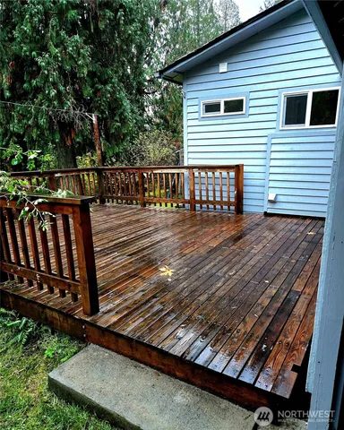 a view of deck with wooden floor and outdoor seating
