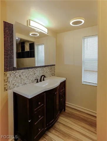 a bathroom with a toilet and a sink