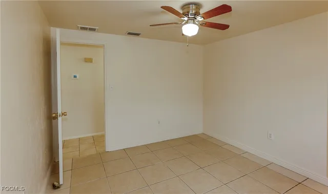 a view of an empty room and window