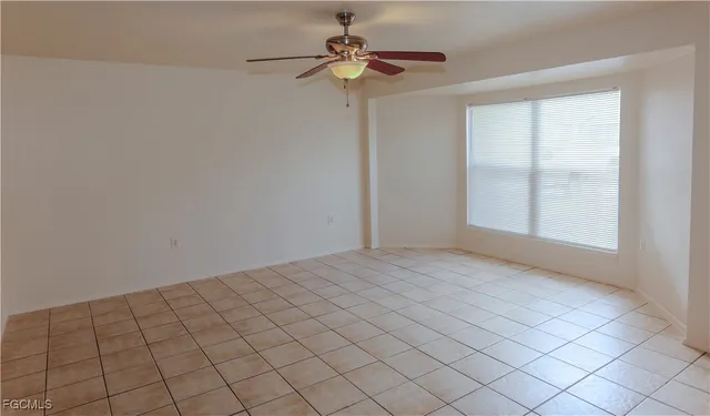 a view of an empty room and window