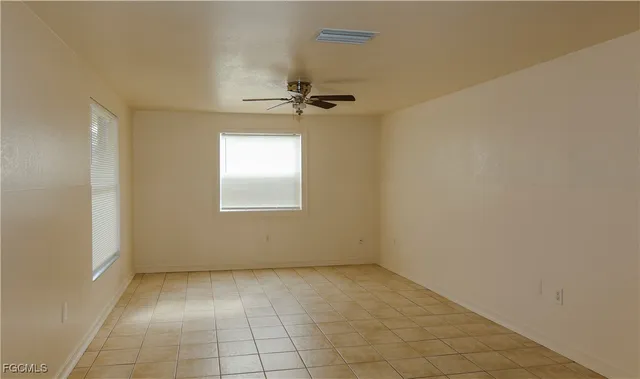 a large kitchen with cabinets and stainless steel appliances