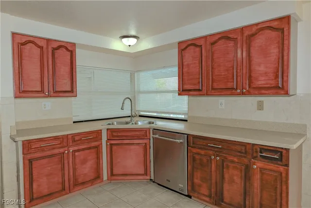 a kitchen with stainless steel appliances granite countertop a refrigerator stove and microwave