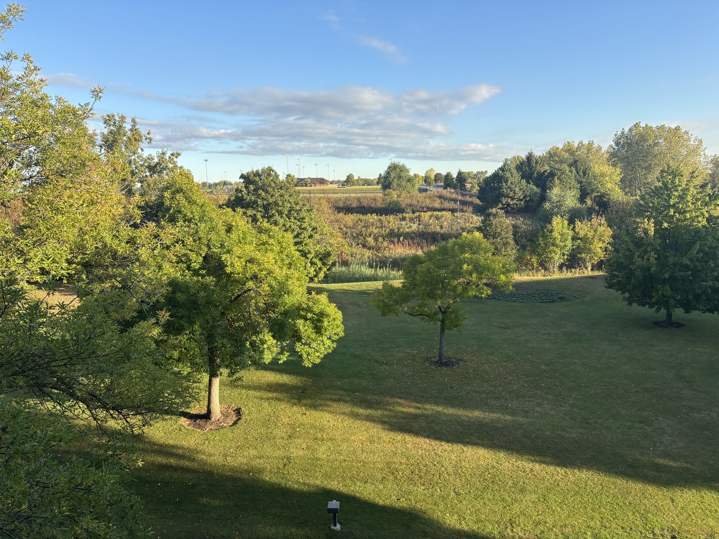 2000 Chestnut Avenue, Unit 407 Glenview, IL 60025 - Photo 12 of 25 a view of a lake with a yard