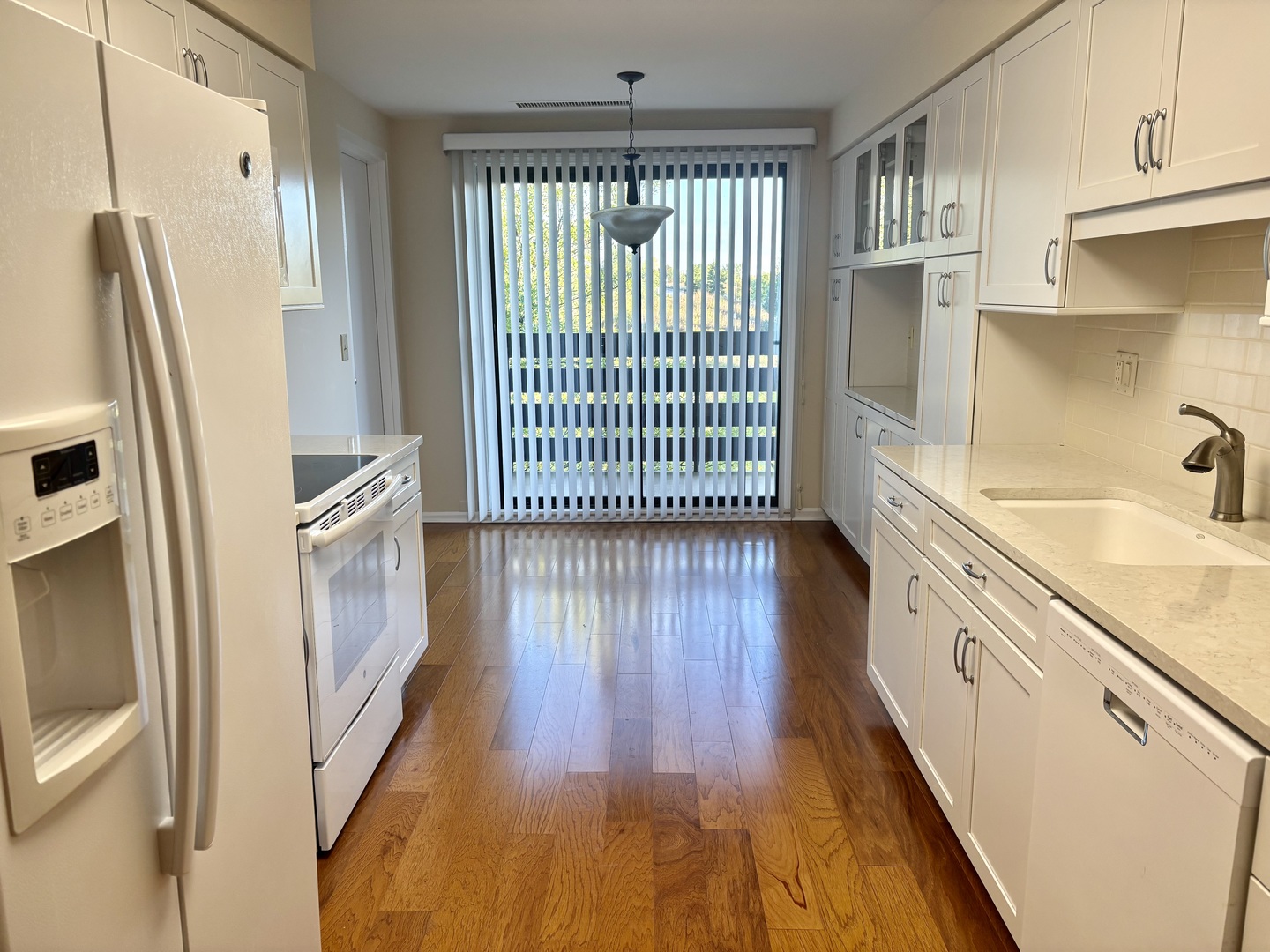 2000 Chestnut Avenue, Unit 407 Glenview, IL 60025 - Photo 7 of 25 a kitchen with stainless steel appliances granite countertop a refrigerator and a sink
