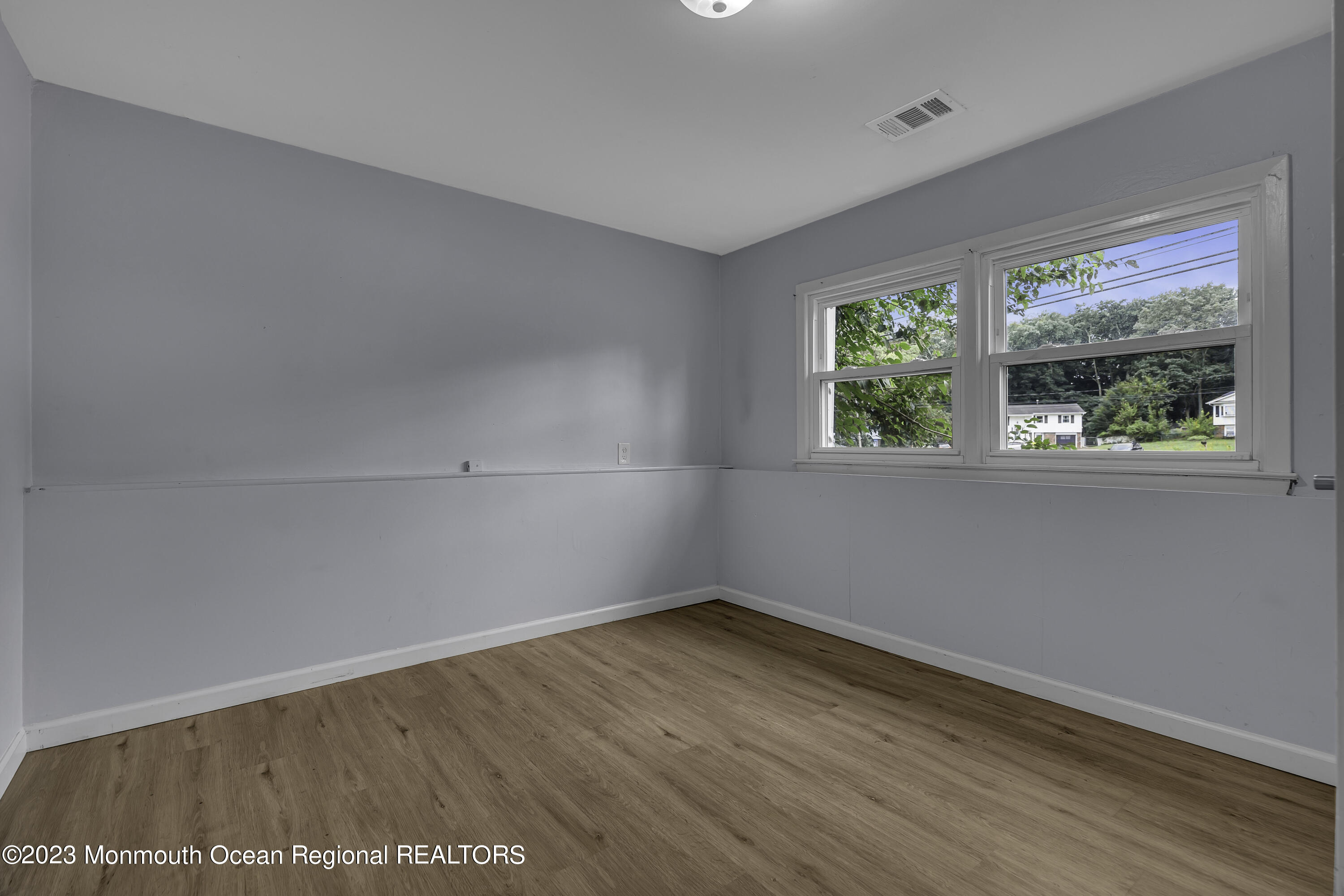 28 Citadel Drive Jackson, NJ 08527 - Photo 12 of 26 wooden floor in an empty room with a window