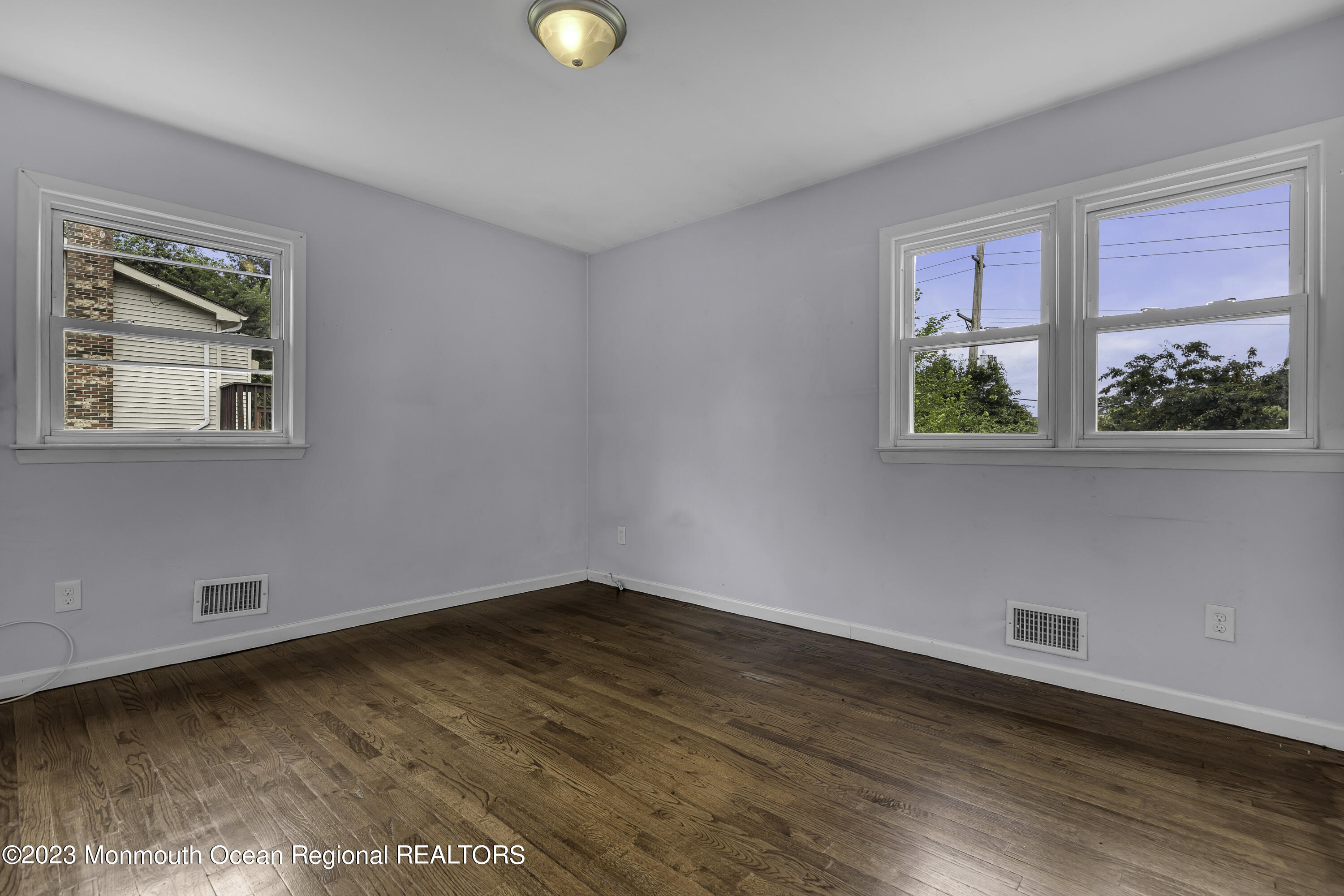 28 Citadel Drive Jackson, NJ 08527 - Photo 14 of 26 a view of an empty room with wooden floor and a window