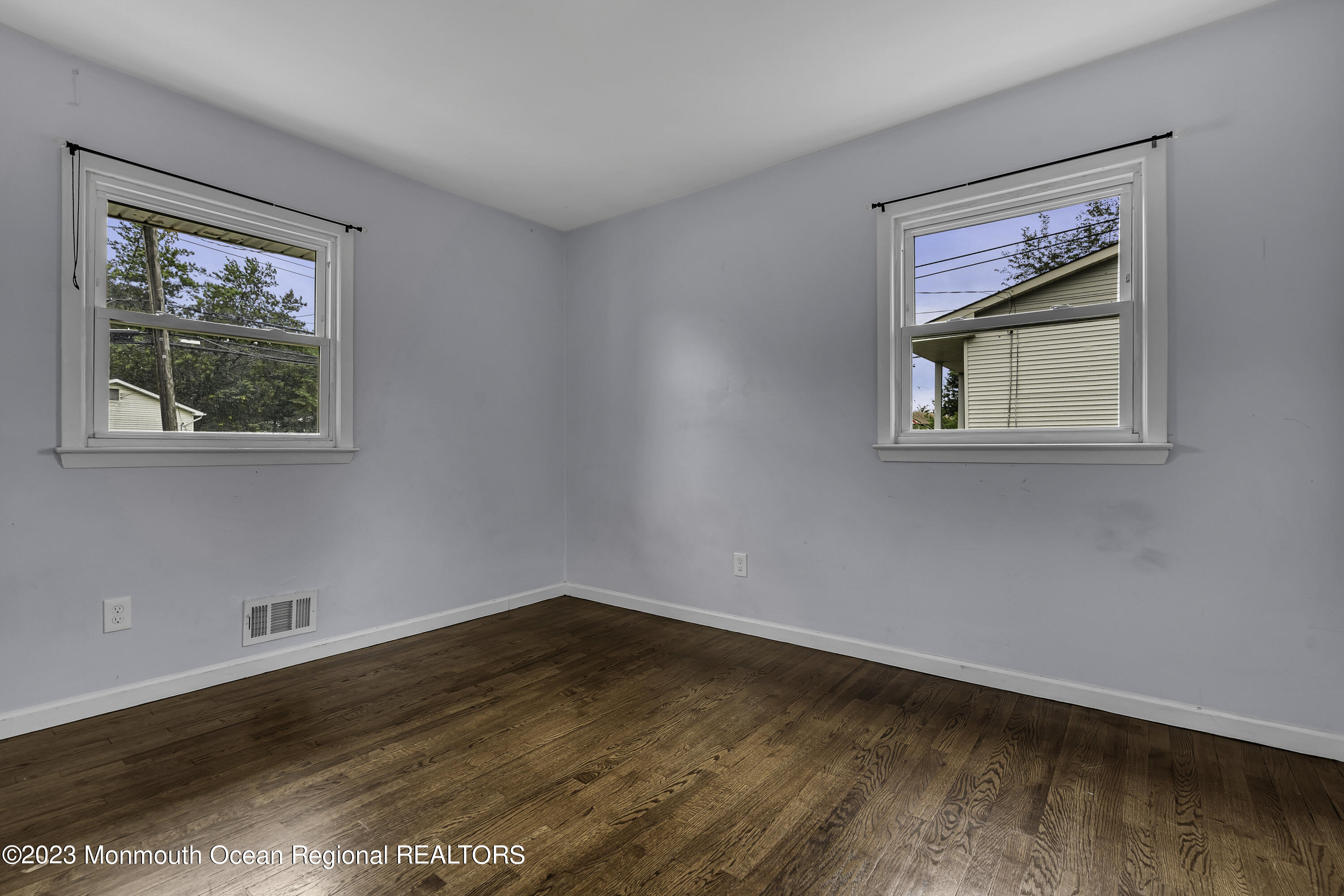 28 Citadel Drive Jackson, NJ 08527 - Photo 15 of 26 a view of an empty room with wooden floor and a window