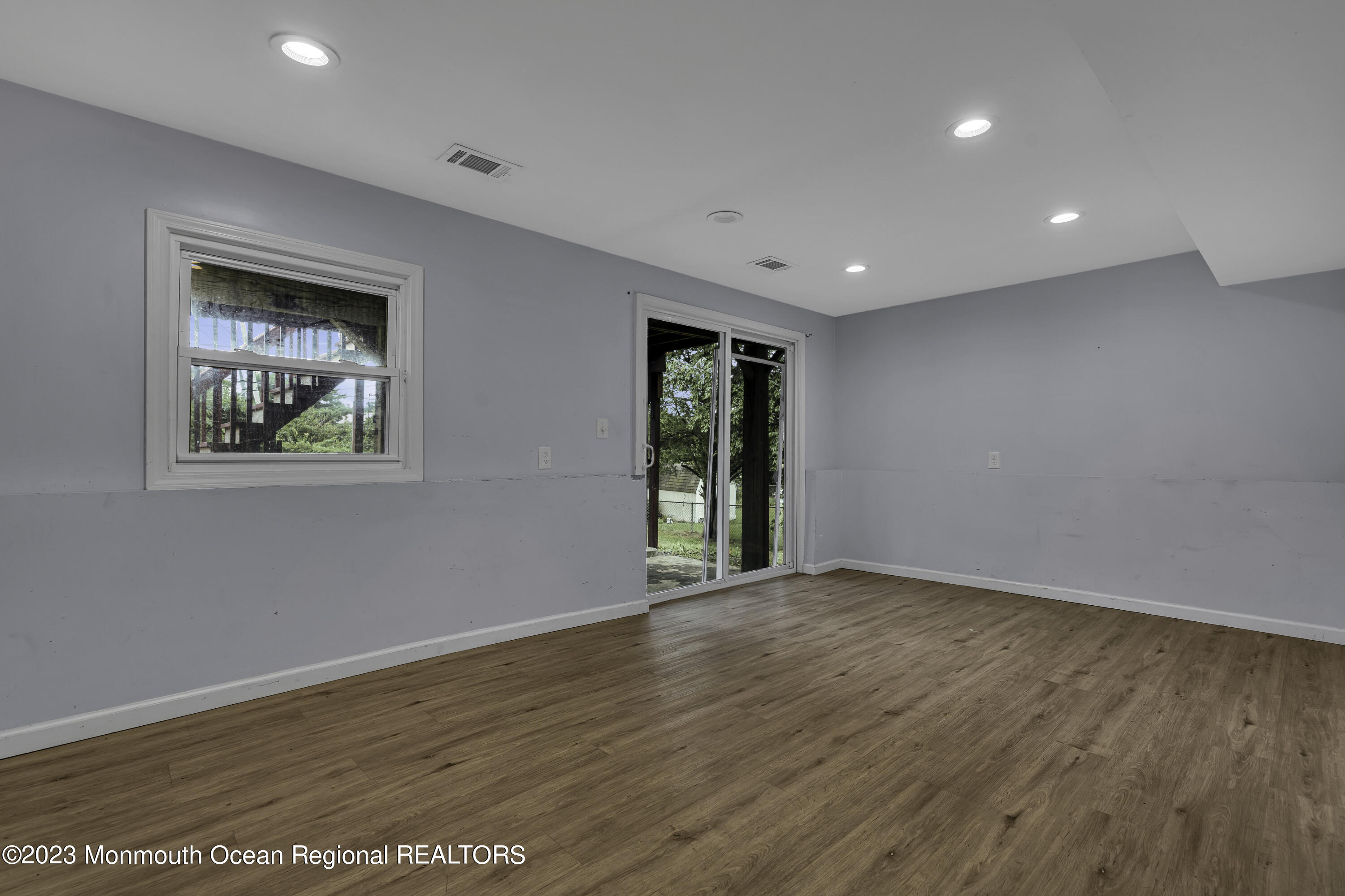 28 Citadel Drive Jackson, NJ 08527 - Photo 21 of 26 a view of an empty room with wooden floor and a window