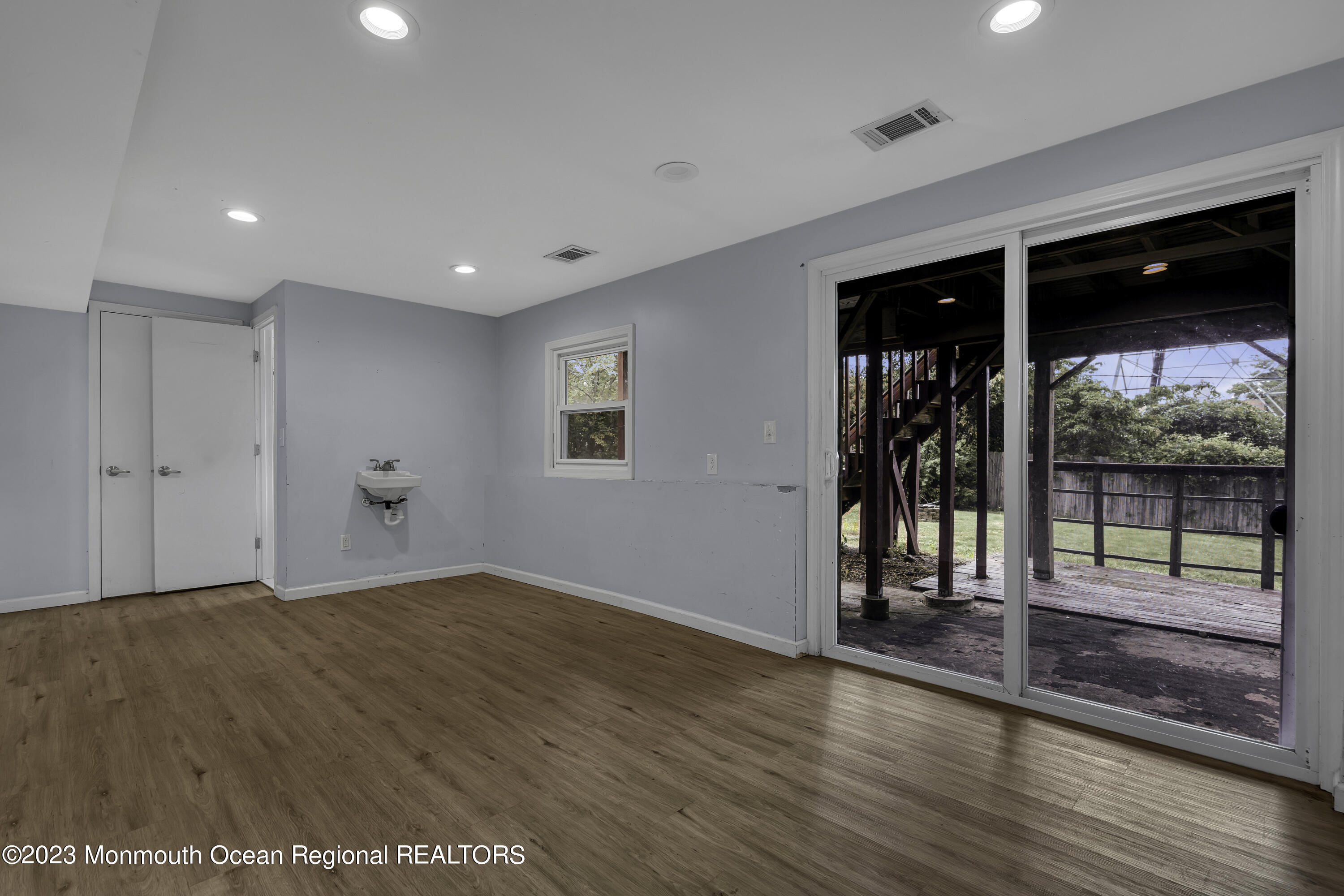 28 Citadel Drive Jackson, NJ 08527 - Photo 22 of 26 wooden floor in an empty room with a window