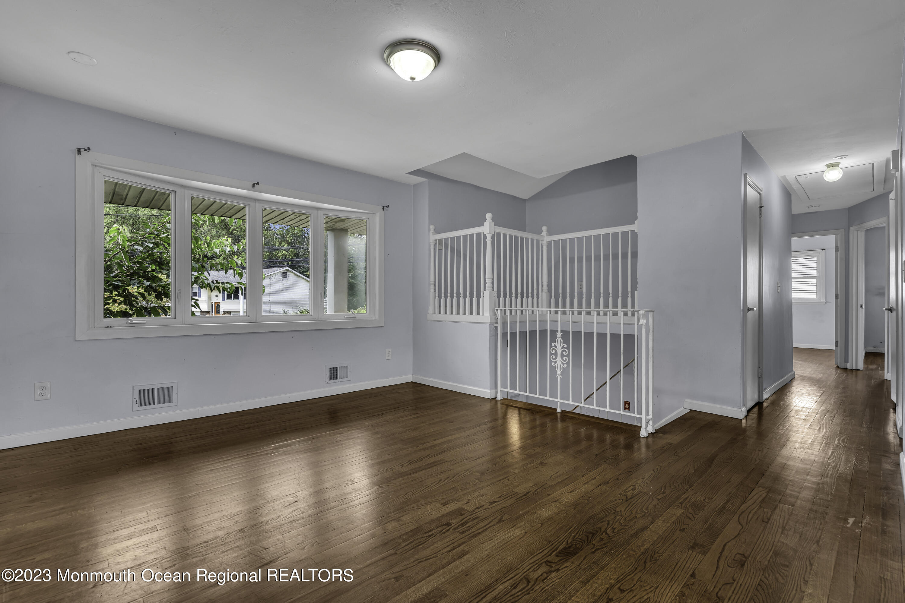 28 Citadel Drive Jackson, NJ 08527 - Photo 5 of 26 an empty room with wooden floor and windows