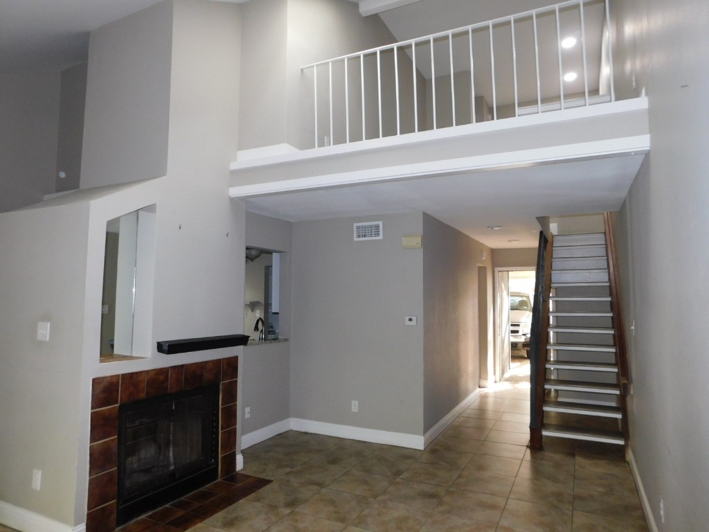 1604 Summer Creek Court, Unit B Austin, TX 78704 - Photo 1 of 1 a view of entryway and hall with a fireplace