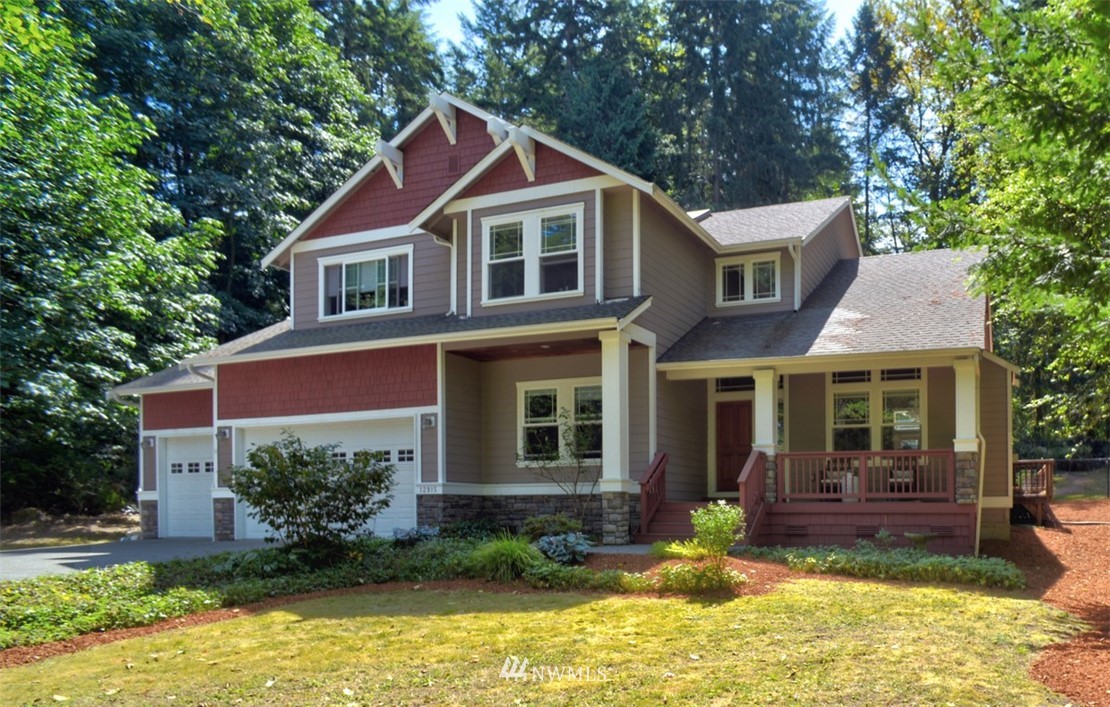 12915 Southeast 95th Way Renton, WA 98056 - Photo 1 of 1 a view of a house with a yard chairs and table in a patio