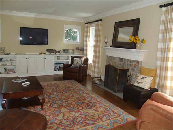 50 Tudor Road Needham, MA 02492 - Photo 3 of 5 a living room with furniture and a fireplace