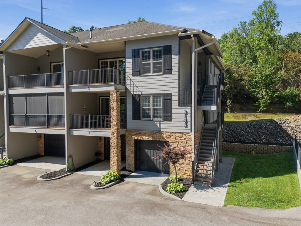 2143 Ridgecrest Circle, Unit 1 Hiawassee, GA 30546 - Photo 49 of 53 a front view of a house with a yard