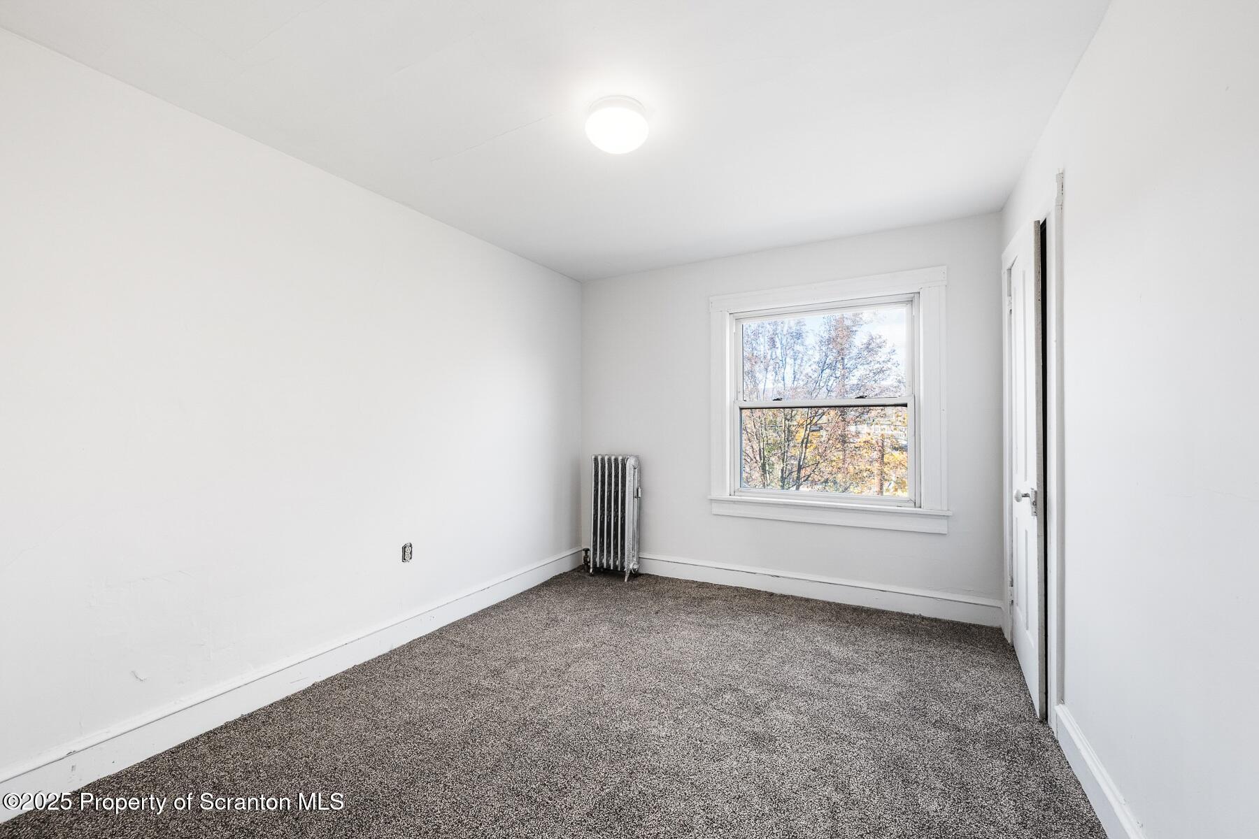 1018 Madison Avenue Scranton, PA 18510 - Photo 11 of 12 an empty room with a window