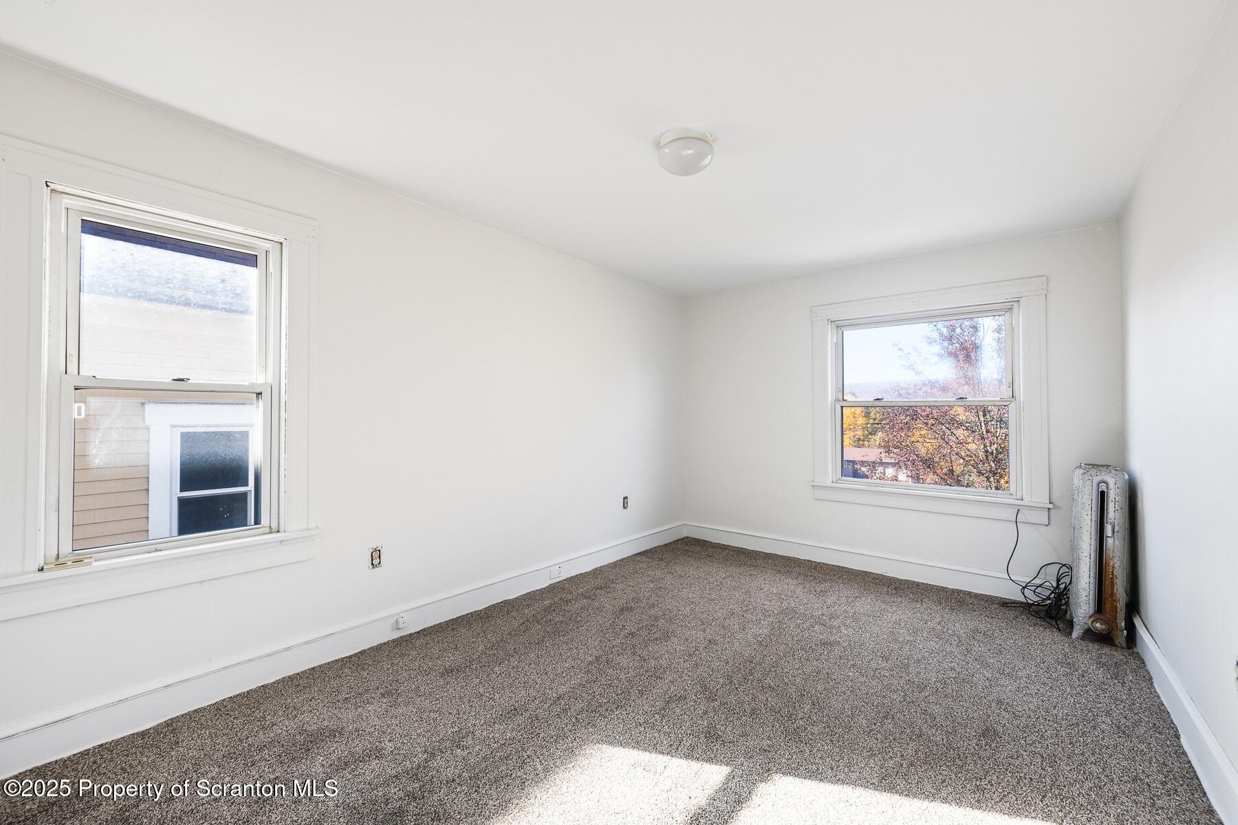1018 Madison Avenue Scranton, PA 18510 - Photo 12 of 12 an empty room with windows