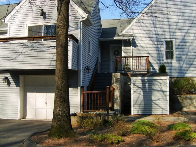 48 Wilton Crest Road, Unit 48 Wilton, CT 06897 - Photo 1 of 1 a view of a house with brick walls