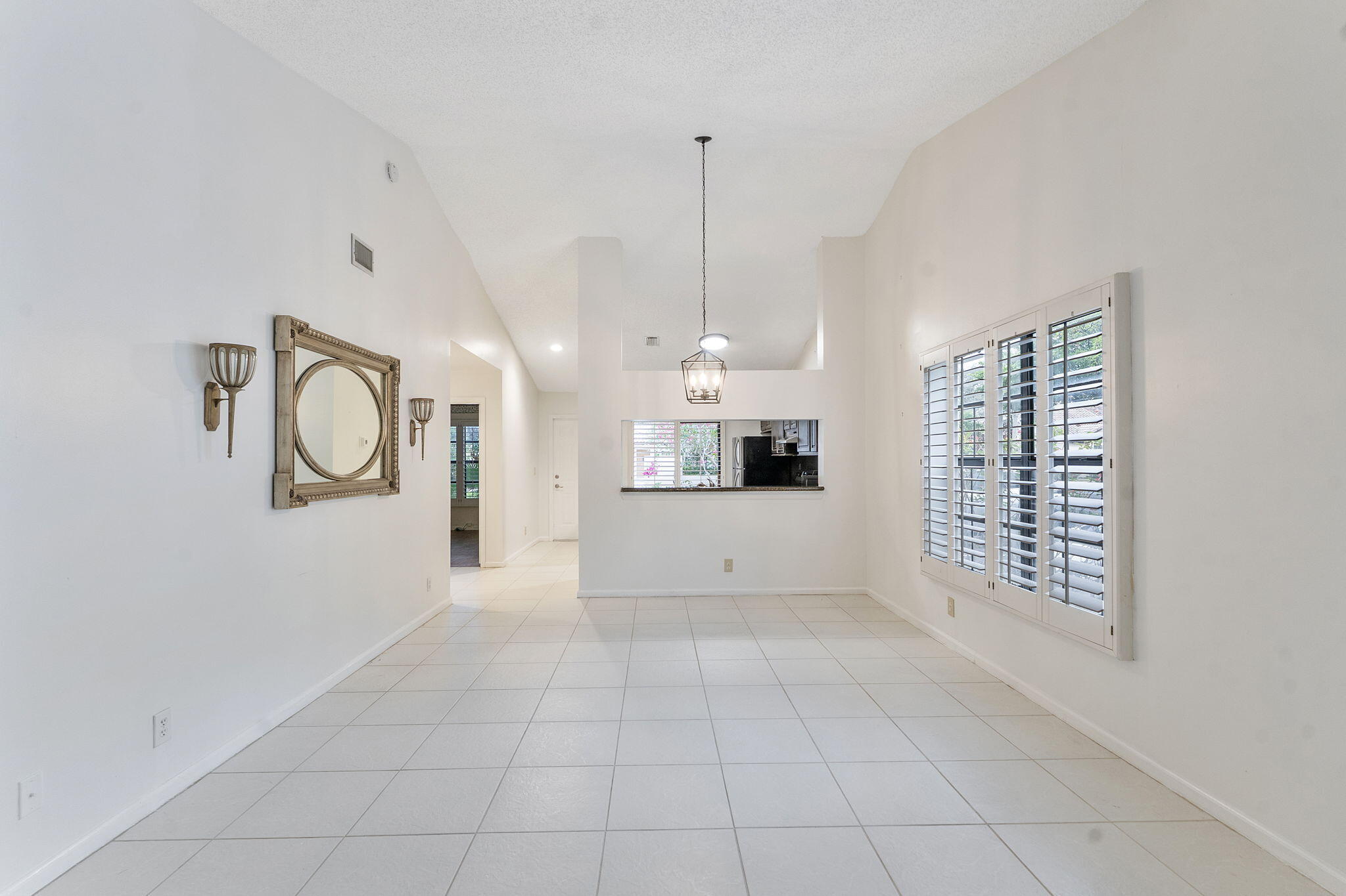 3088 Inglewood Terrace Boca Raton, FL 33431 - Photo 11 of 30 a big room with chandelier fan and windows