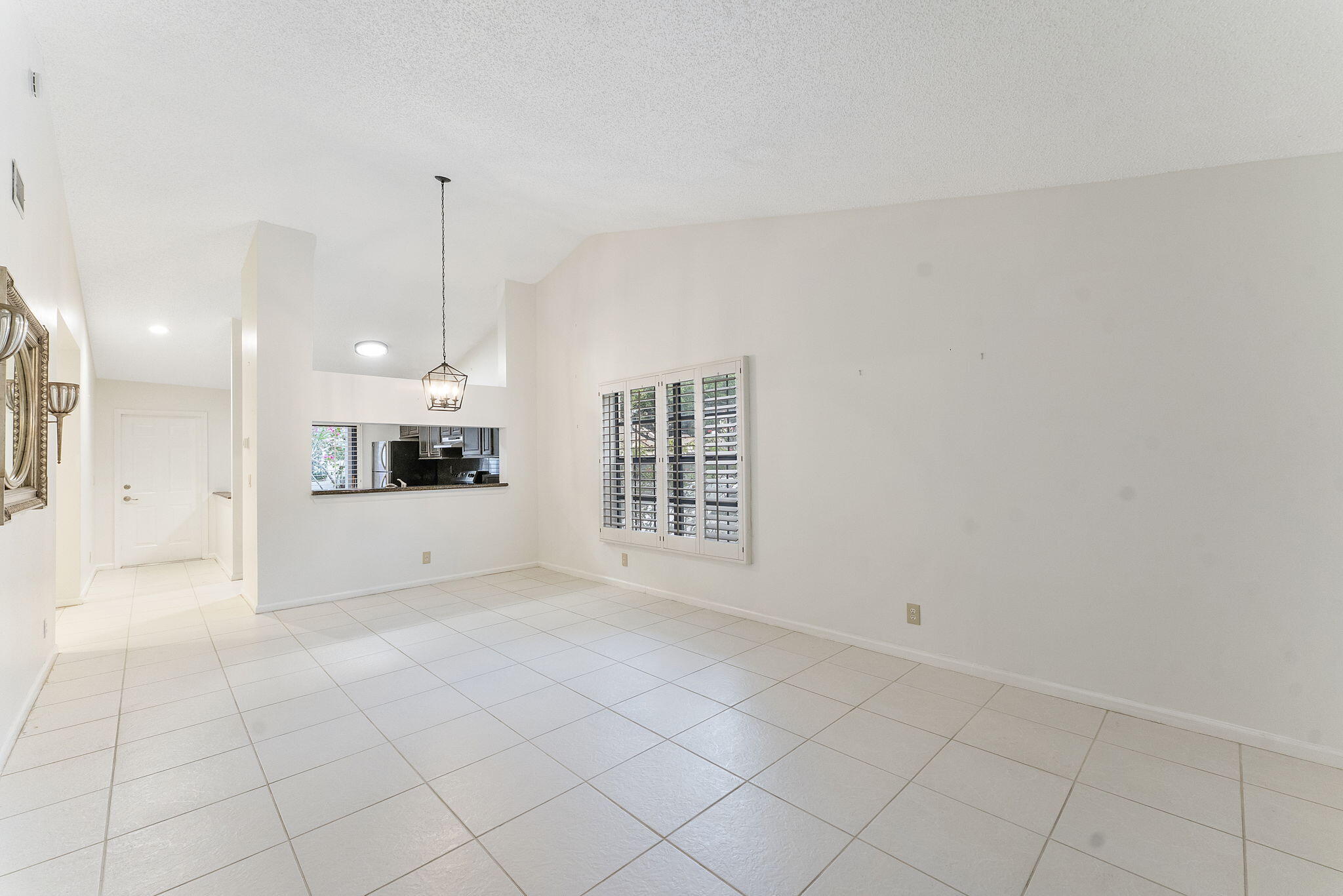 3088 Inglewood Terrace Boca Raton, FL 33431 - Photo 13 of 30 a view of an empty room and kitchen view