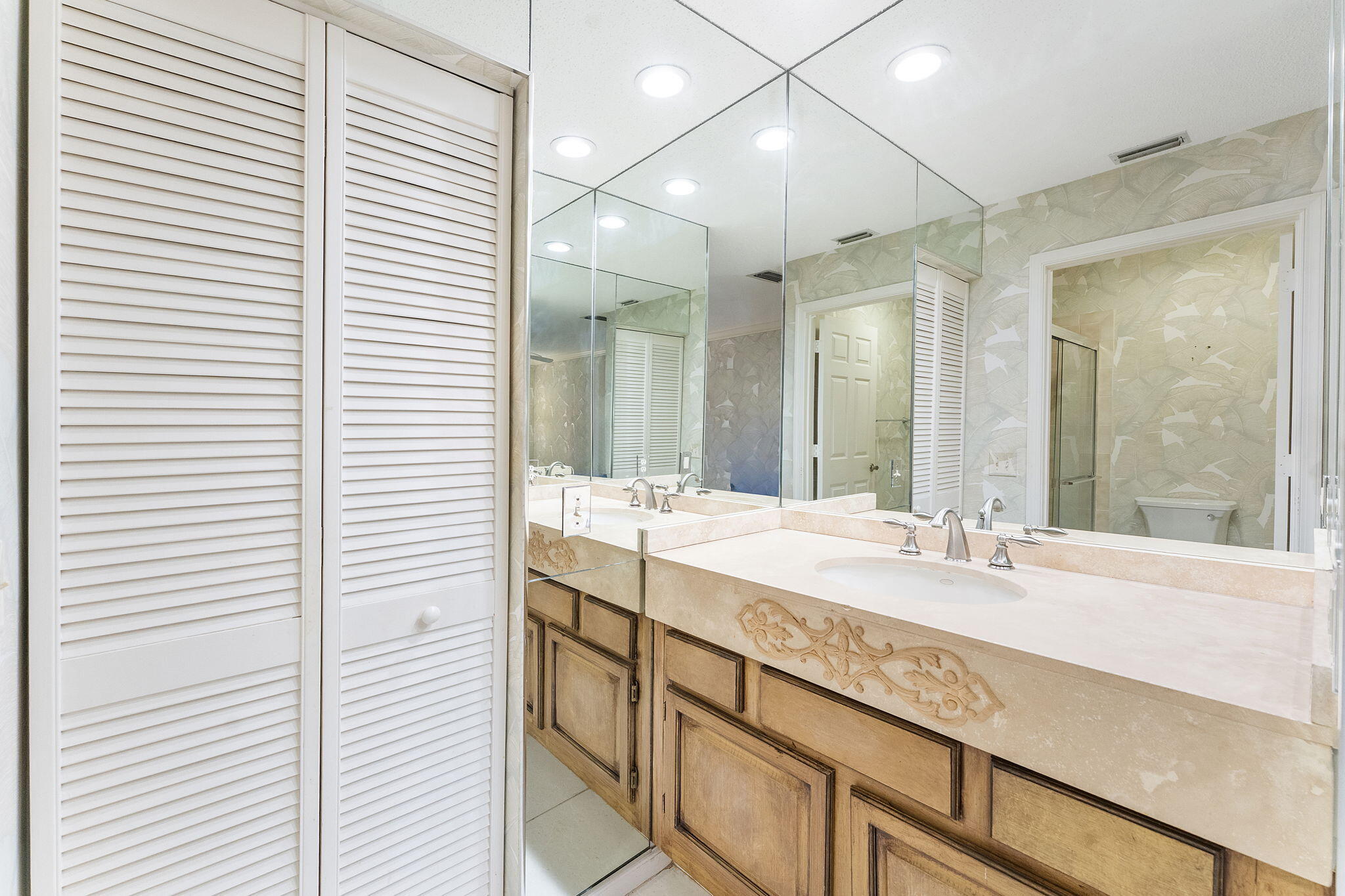 3088 Inglewood Terrace Boca Raton, FL 33431 - Photo 17 of 30 a bathroom with a sink and a mirror