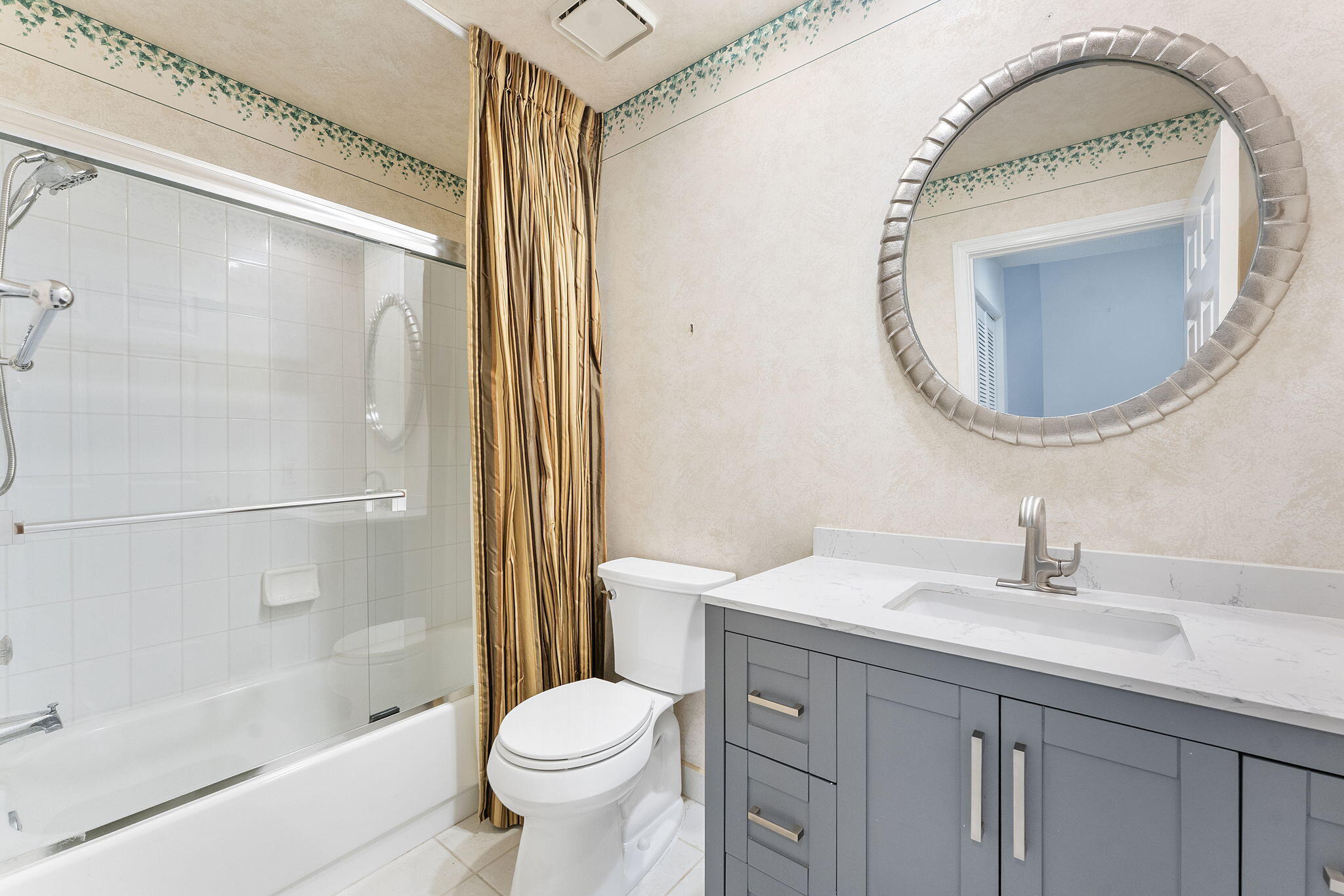 3088 Inglewood Terrace Boca Raton, FL 33431 - Photo 18 of 30 a bathroom with a sink a toilet and a mirror