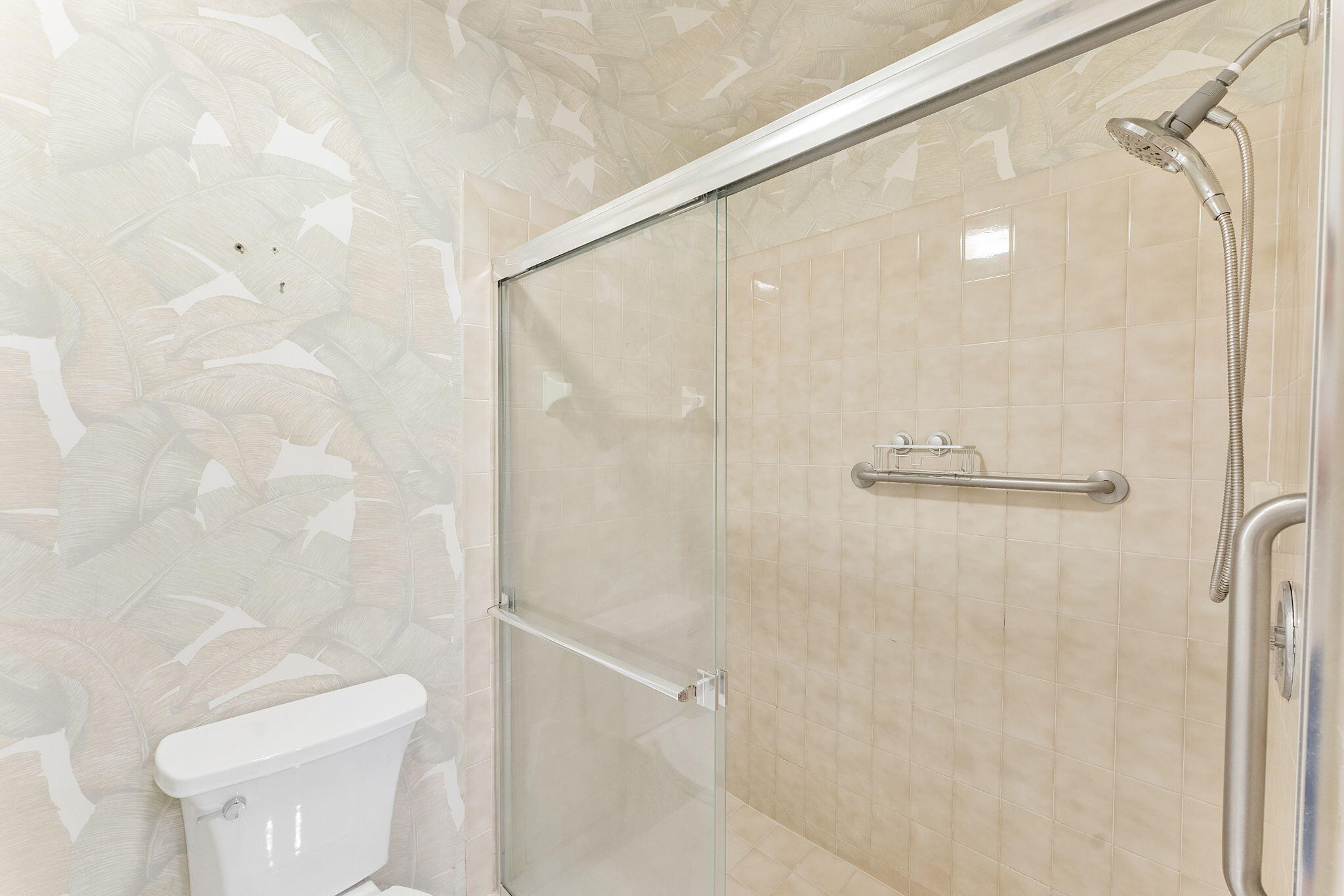 3088 Inglewood Terrace Boca Raton, FL 33431 - Photo 19 of 30 a bathroom with a shower and a toilet