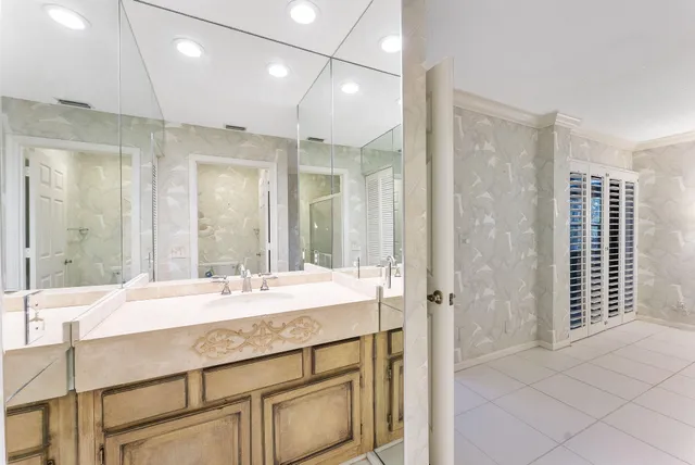 a bathroom with a sink double vanity and a shower