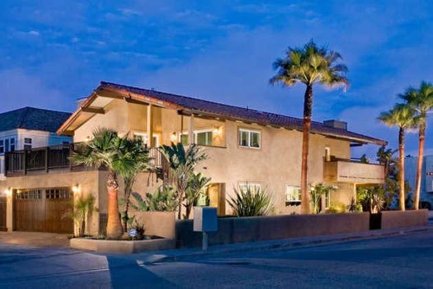 1030 Mandalay Beach Road Oxnard, CA 93035 - Photo 1 of 39 a front view of a house with garden